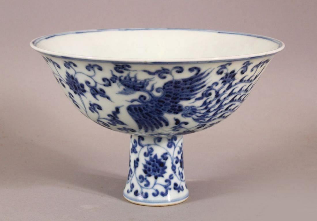A CHINESE BLUE AND WHITE STEM CUP, the bowl painted (1 of 7)