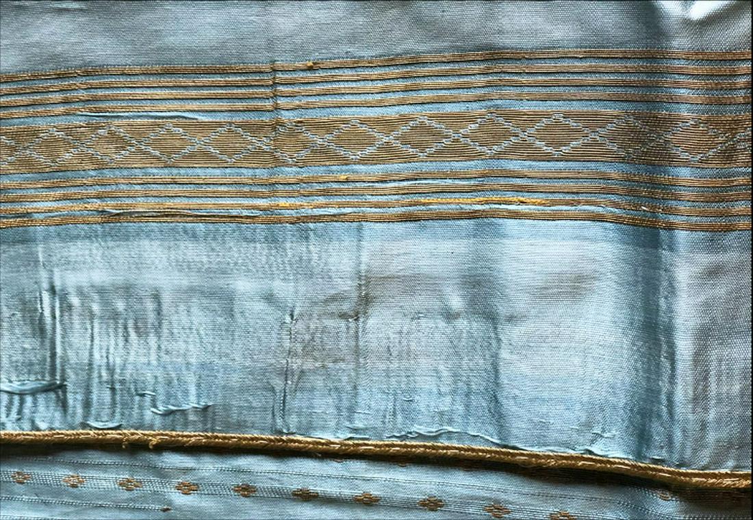 A SYRIAN ABBA SLEEVELESS GOWN, turquoise ground with: A SYRIAN ABBA SLEEVELESS GOWN, turquoise ground with gilt decoration (af), approx. 4ft 6in long.