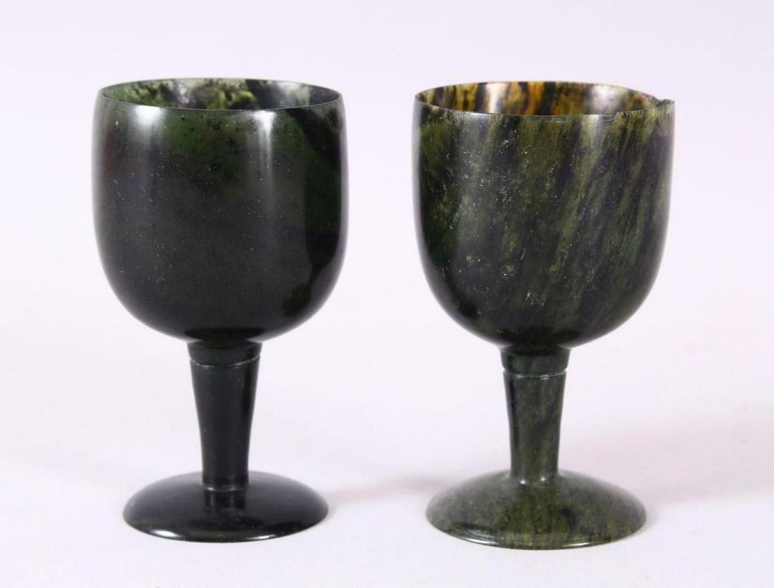 A GOOD PAIR OF MUGHAL CARVED SPINACH GREEN JADE: A GOOD PAIR OF MUGHAL CARVED SPINACH GREEN JADE GOBLETS, 10cm high X 5.6cm diameter