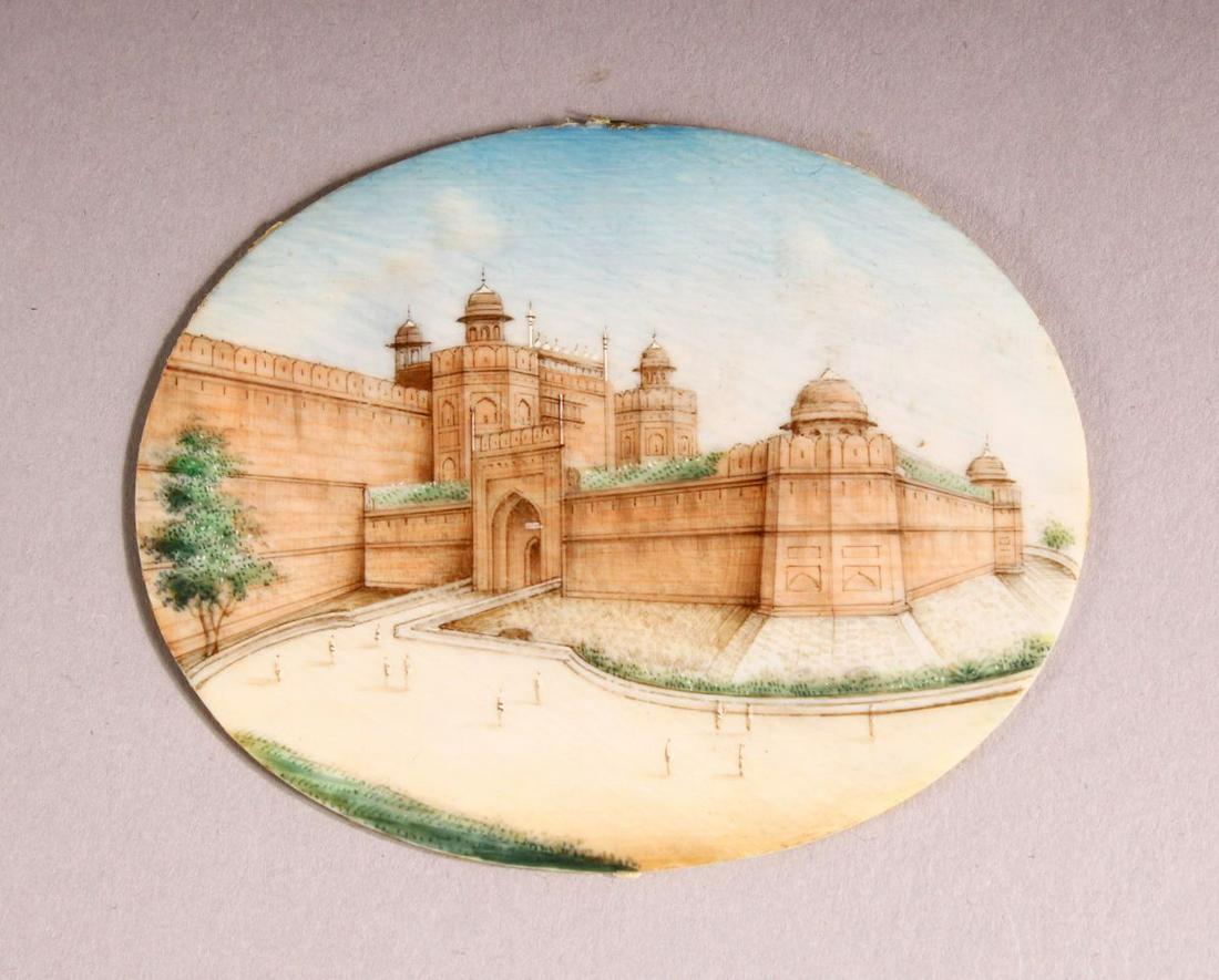 AN INDIAN MINIATURE PAINTED OVAL depicting a fort, (1 of 2)