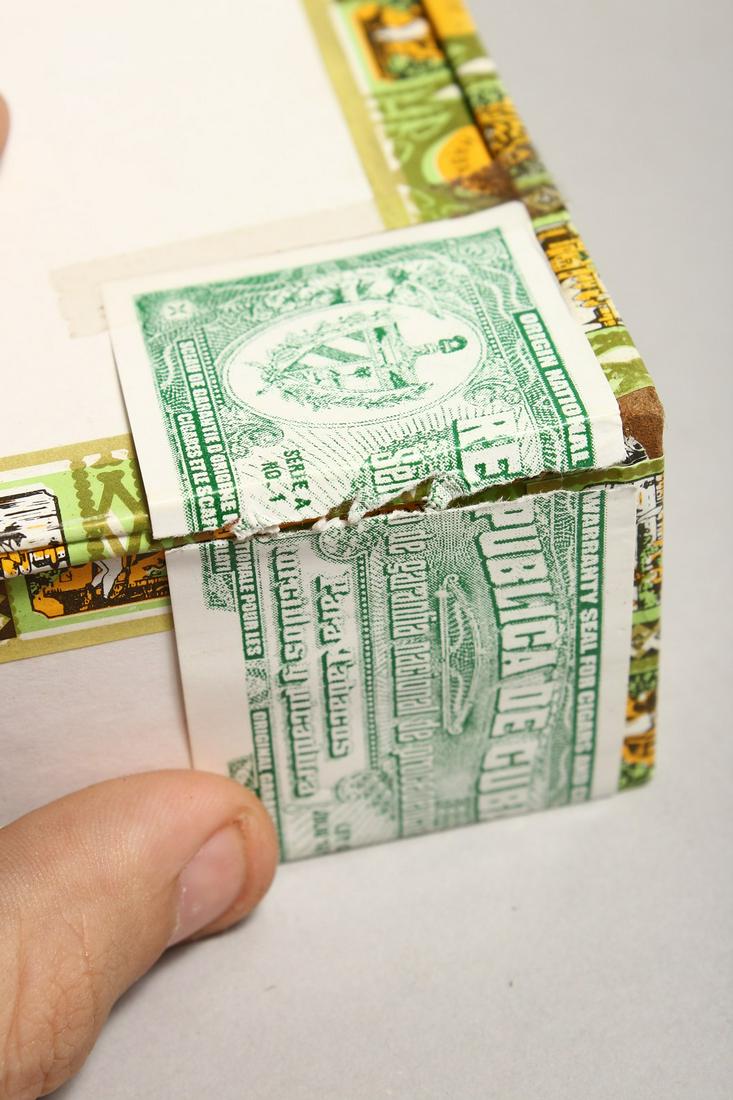 A BOX OF 25 CIGARS in a Romeo and Juliet box.