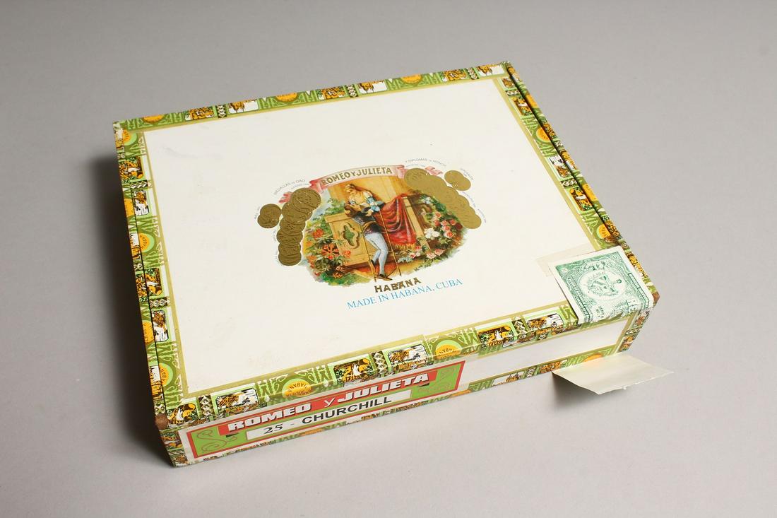 A BOX OF 25 CIGARS in a Romeo and Juliet box.
