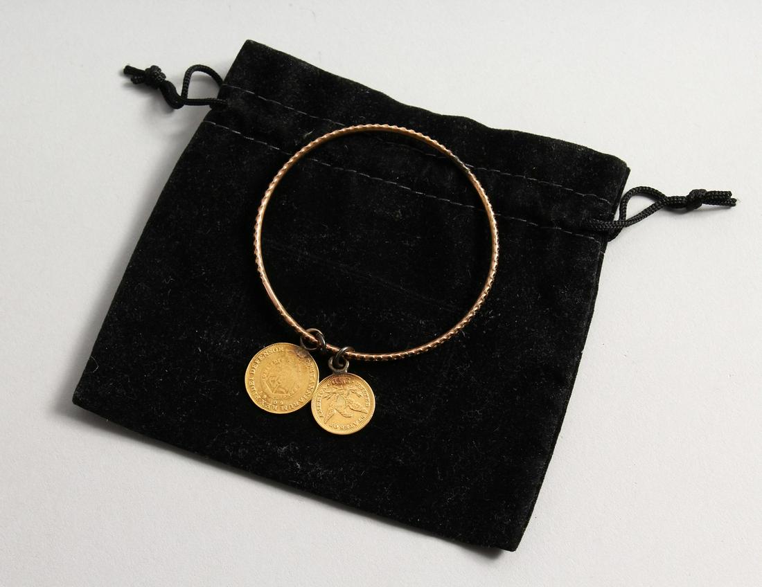 A 1901 UNITED STATES OF AMERICA GOLD COIN and a George: A 1901 UNITED STATES OF AMERICA GOLD COIN and a George III Gold coin 1809 on a bracelet. (2).