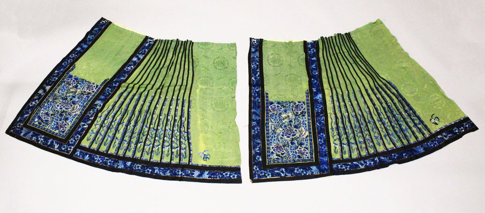 TWO CHINESE EMBROIDERED SILK SKIRT / ROBE PANELS,: TWO CHINESE EMBROIDERED SILK SKIRT / ROBE PANELS, finely embroidered with flowers and butterflies, each approx. 85cm x 83cm.