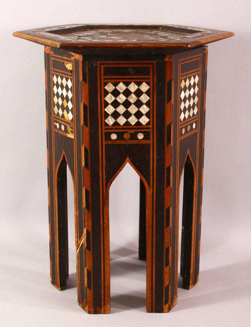 A SMALL MOORISH INLAID HEXAGONAL TOP TABLE - the table: A SMALL MOORISH INLAID HEXAGONAL TOP TABLE - the table inlaid with mother of pearl ( with losses ) and inlaid exotic woods, 49cm high x 40cm wide.