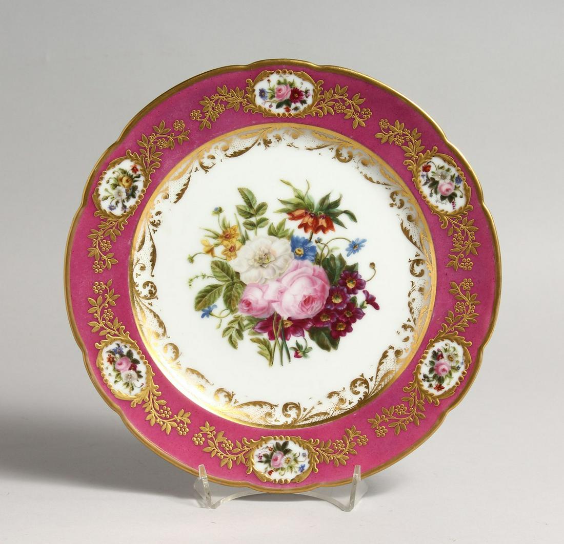 A 19TH CENTURY FRENCH DENVELLE PORCELAIN PLATE with: A 19TH CENTURY FRENCH DENVELLE PORCELAIN PLATE with rose coloured border, vignettes of flowers, gilt decoration, the centre painted with wild flowers. Printed mark: DENVELLE. B'VARD, St. DENIS 18 a PA
