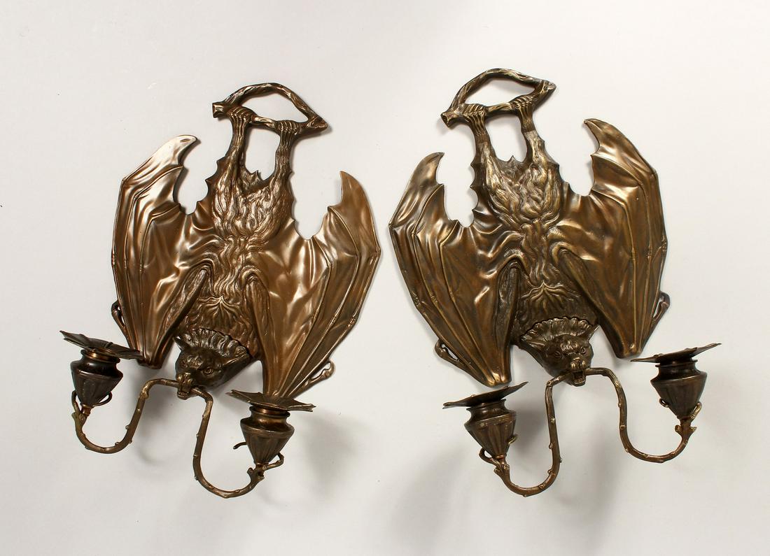 AN UNUSUAL PAIR OF CAST BRONZE BAT SHAPED TWIN LIGHT: AN UNUSUAL PAIR OF CAST BRONZE BAT SHAPED TWIN LIGHT WALL SCONSES.