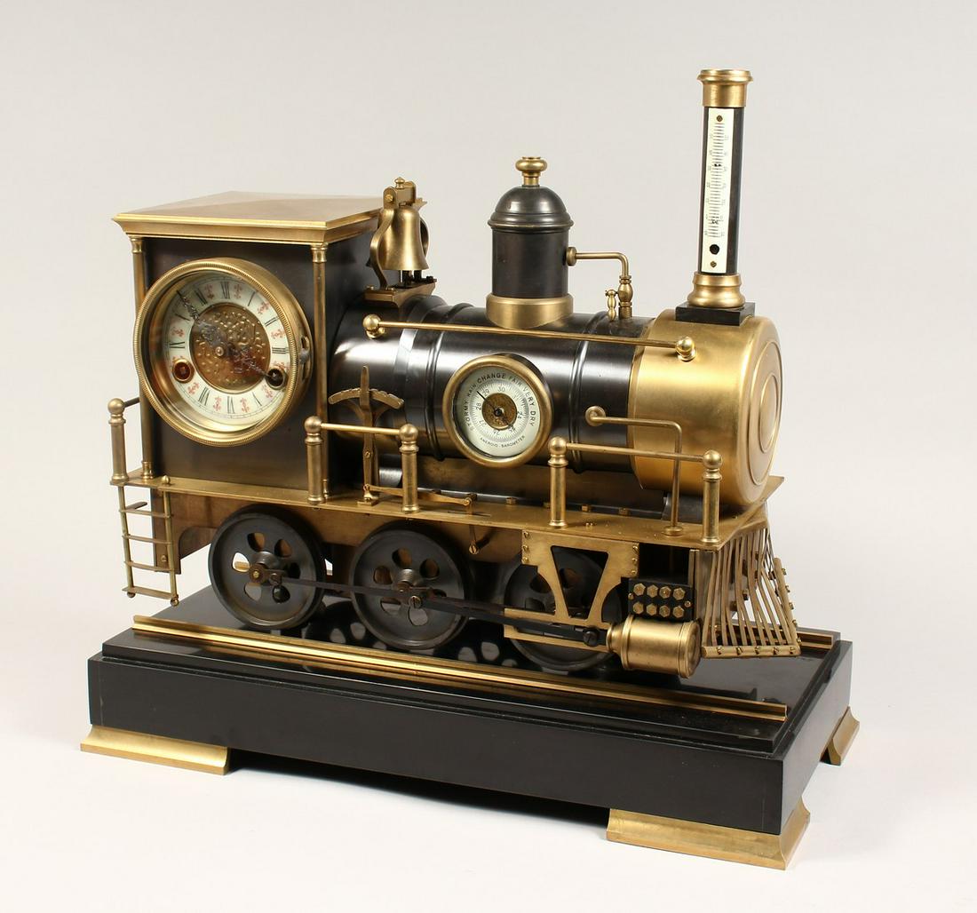 AN UNUSUAL INDUSTRIAL STYLE COMBINATION CLOCK,: AN UNUSUAL INDUSTRIAL STYLE COMBINATION CLOCK, THERMOMETER AND BAROMETER, modelled as a train mounted on a marble base. 18.5ins long x 18ins high