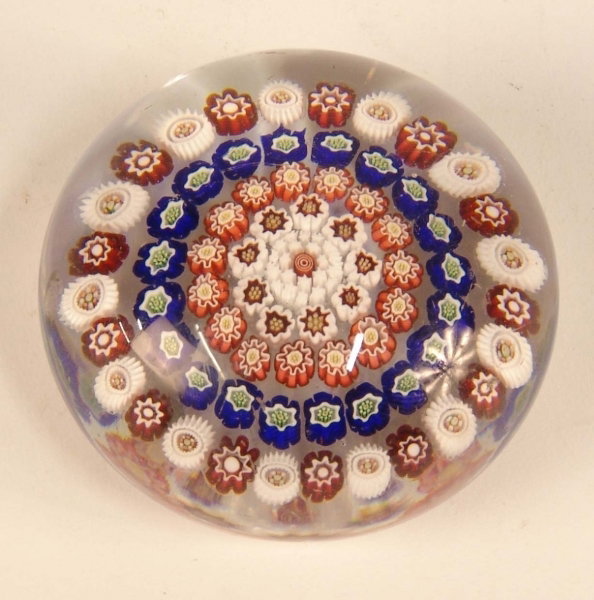 A MILIFIORE PAPERWEIGHT 2½ins diameter.