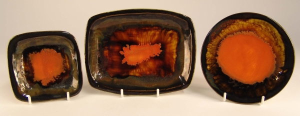 ERIC LEAPER Three small orange speckled dishes, r