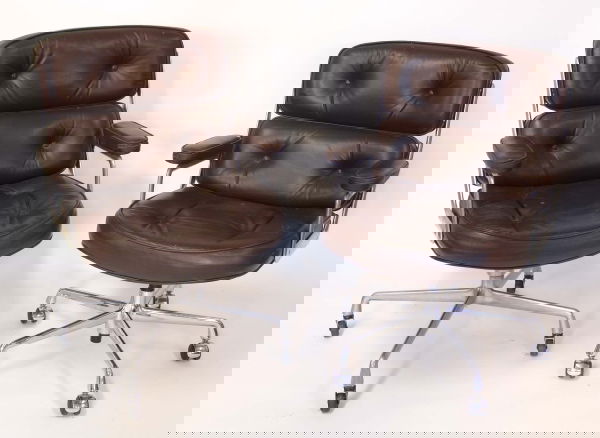 CHARLES & RAY EAMES A pair of leather and alumini: CHARLES & RAY EAMES A pair of leather and aluminium time life chairs, circa 1960s.