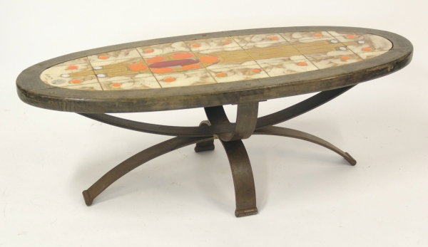 DESIGNER UNKNOWN An oval tiled top and wrought ir