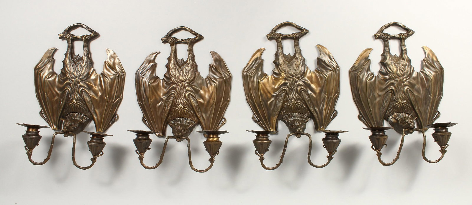 A GOOD SET OF FOUR BAT'S WING TWO BRANCH CANDLE SCONCES: A GOOD SET OF FOUR BAT'S WING TWO BRANCH CANDLE SCONCES