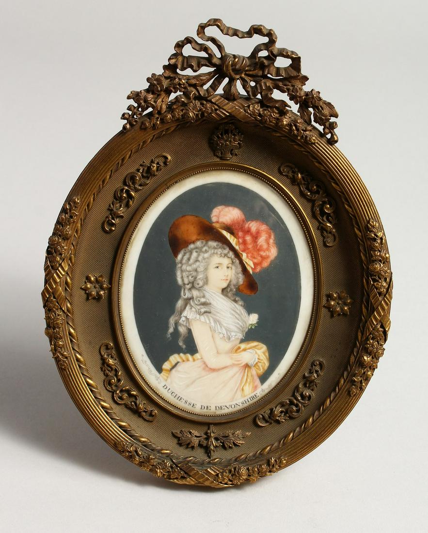 A SUPERB OVAL FRAMED PORTRAIT OF DUCHESSE DE: A SUPERB OVAL FRAMED PORTRAIT OF DUCHESSE DE DEVONSHIRE. 5ins x 3.5ins in a ormolu frame with scrolls, flowers and ribbons. 8.5ins x 6.5ins overall.
