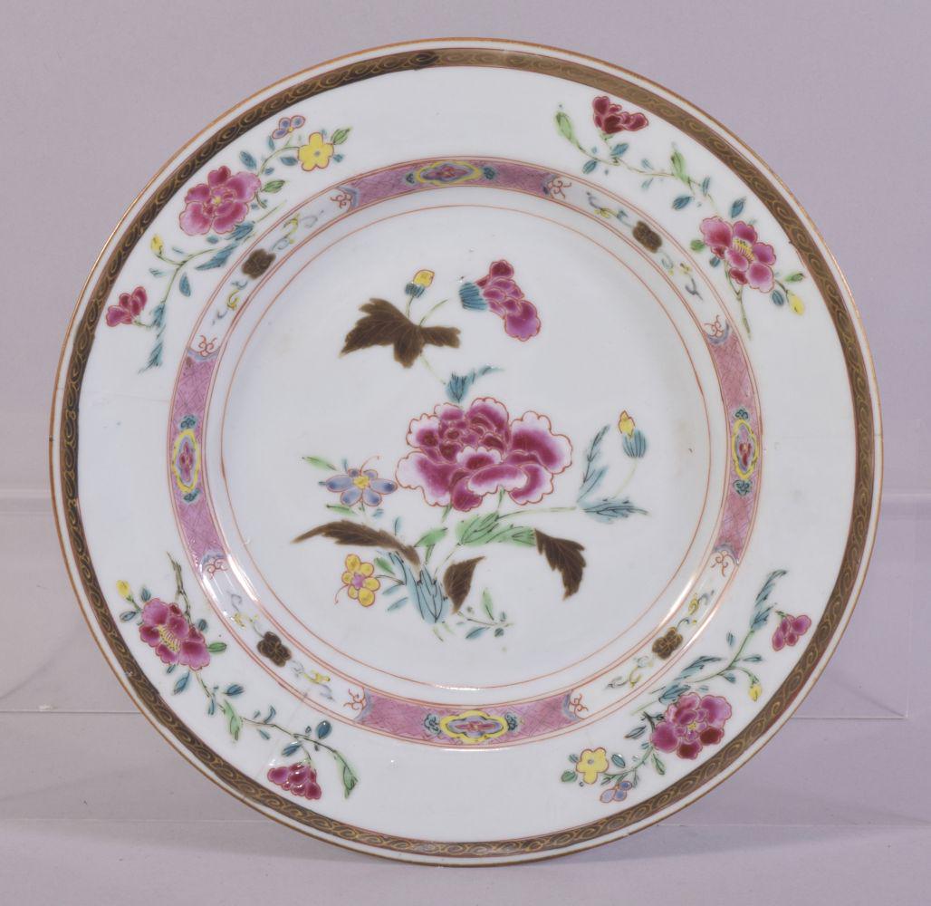 A CHINESE FAMILLE ROSE PORCELAIN PLATE, painted with: A CHINESE FAMILLE ROSE PORCELAIN PLATE, painted with flowers and a band of floral motifs, 22.5cm diameter.