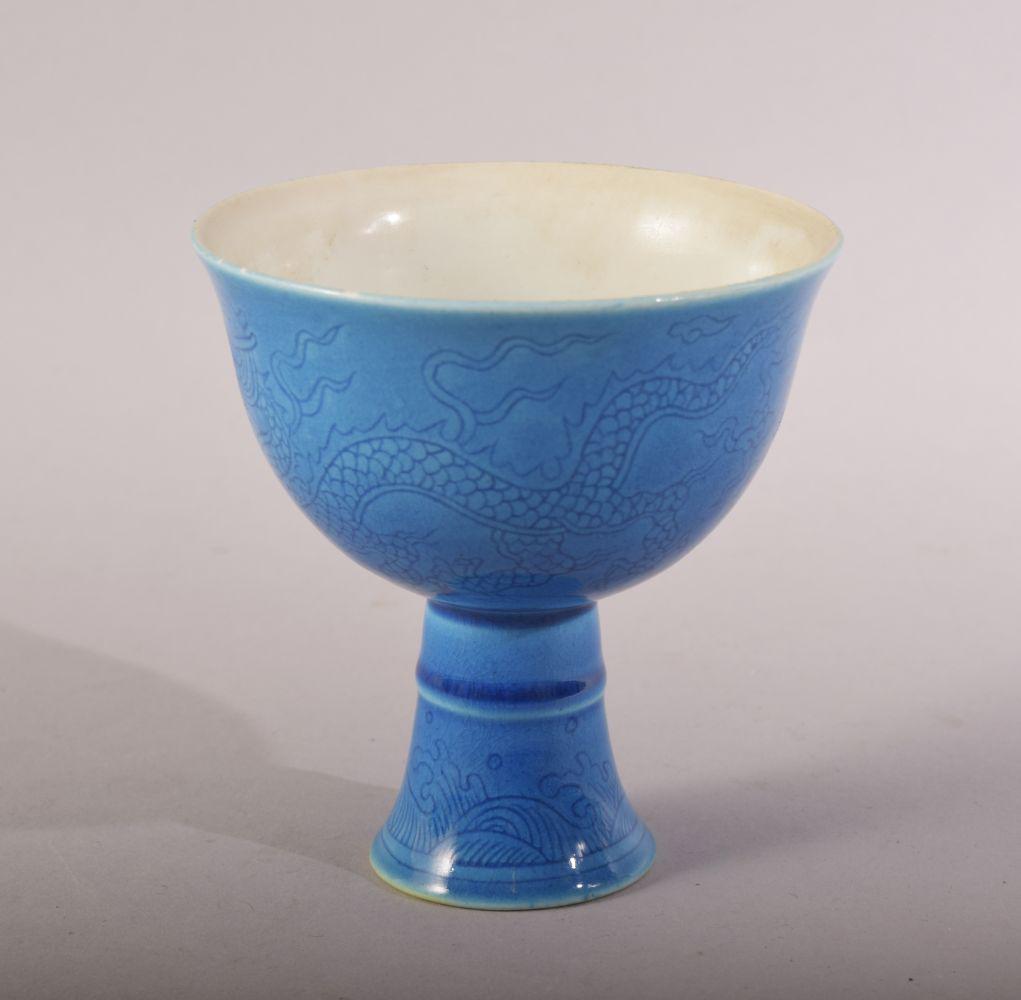 A CHINESE MING STYLE TURQUOISE DRAGON CUP - the body: A CHINESE MING STYLE TURQUOISE DRAGON CUP - the body incised with dragons and the base with a six character mark - 8.5cm