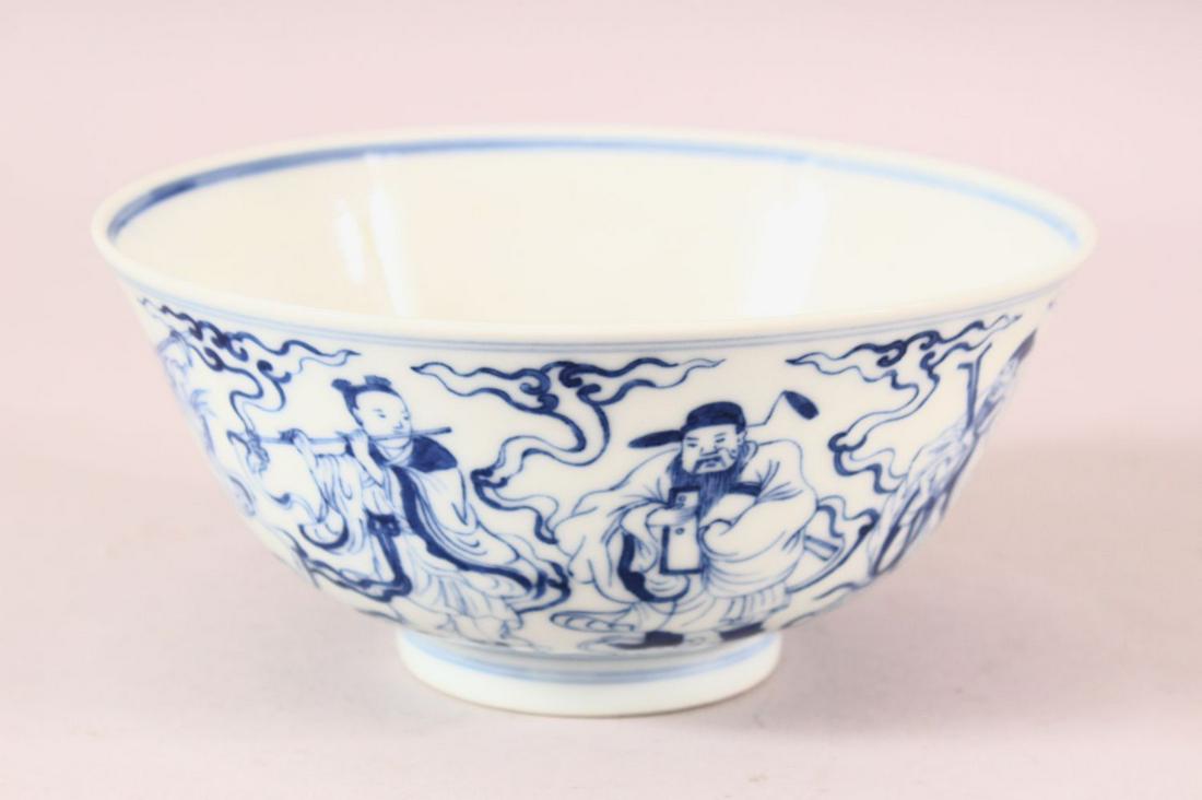 A CHINESE BLUE AND WHITE PORCELAIN IMMORTAL BOWL, the: A CHINESE BLUE AND WHITE PORCELAIN IMMORTAL BOWL, the exterior decorated with eight immortals amongst clouds and waves, the interior decorated with shou lao seated with two attendants, six character m