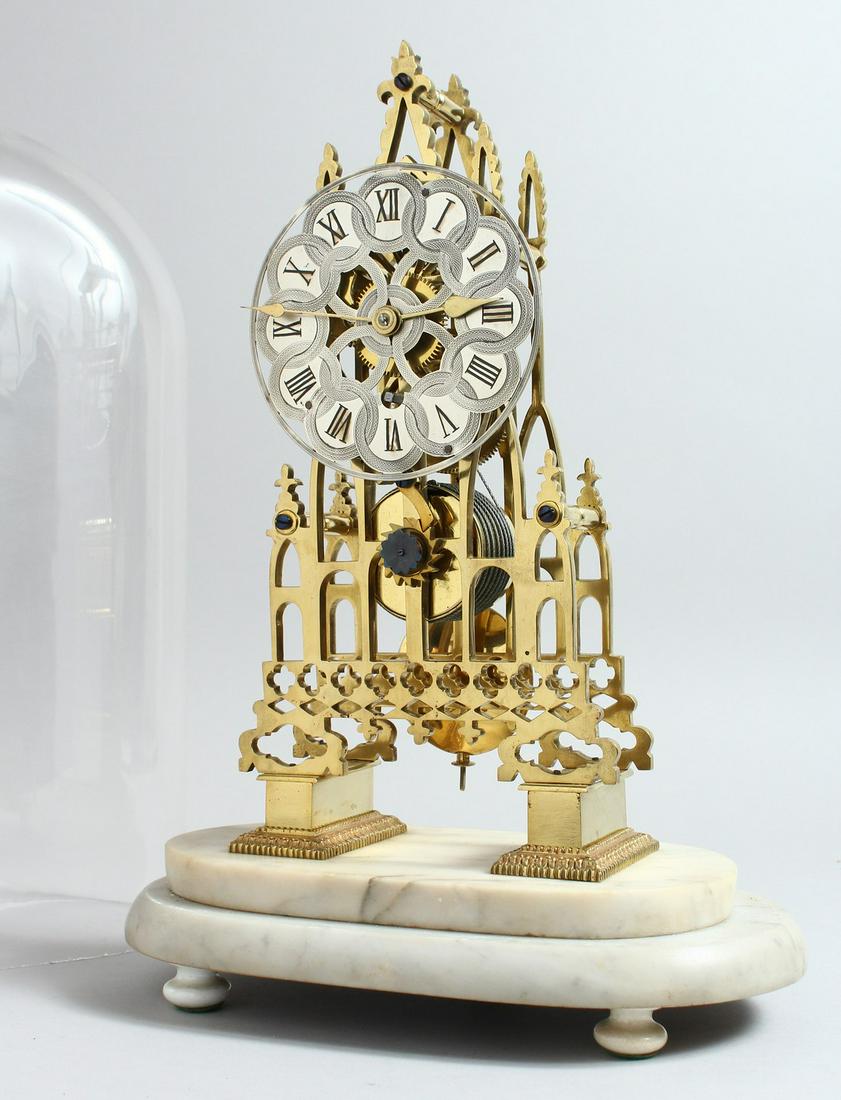 A VICTORIAN BRASS SKELETON CLOCK, CIRCA. 1880. of: A VICTORIAN BRASS SKELETON CLOCK, CIRCA. 1880. of Cathedral form on a white marble base with glass dome. 1ft 4ins high including base.