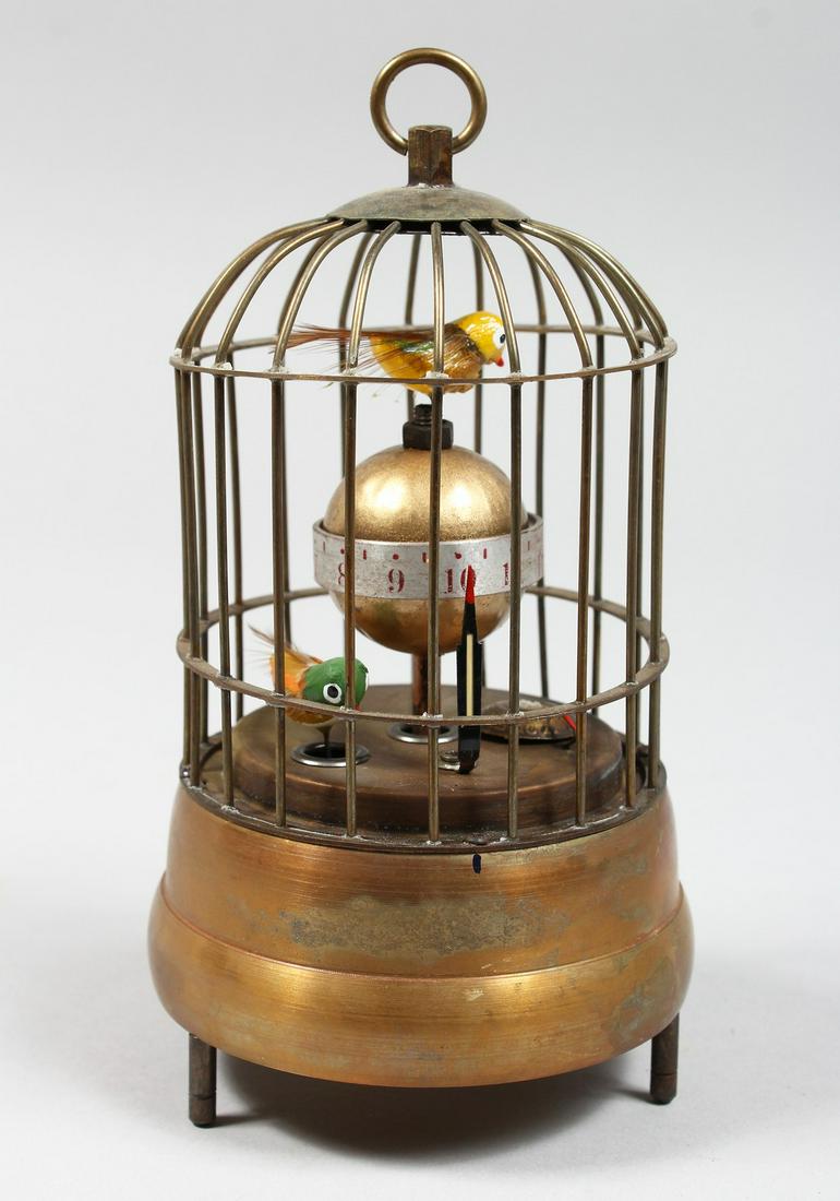 A NOVELTY BIRD CAGE CLOCK 7ins high.: A NOVELTY BIRD CAGE CLOCK 7ins high.