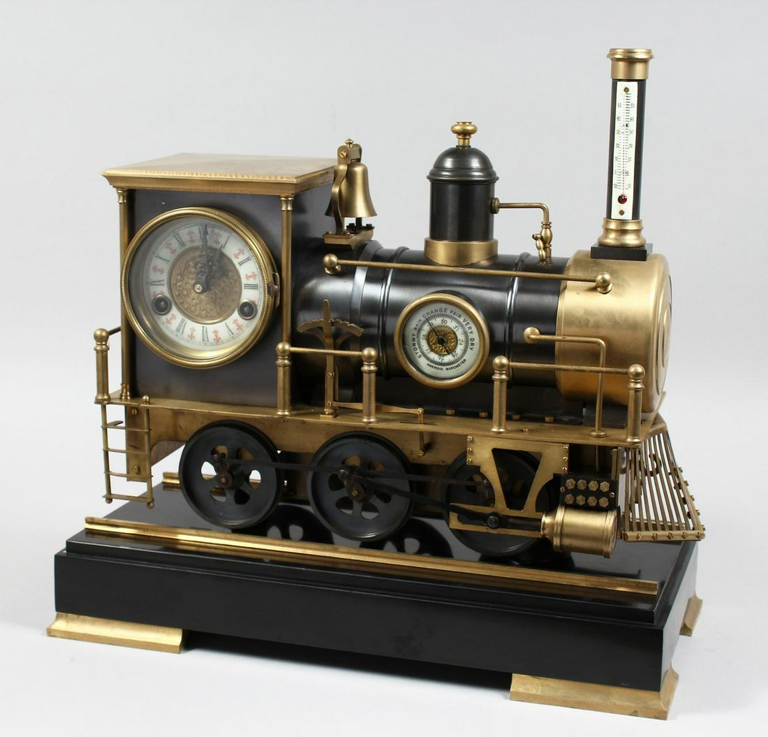 AN UNUSUAL INDUSTRIAL STYLE CLOCK WITH BAROMETER AND THERMOMETER, modelled as a steam train, on a: AN UNUSUAL INDUSTRIAL STYLE CLOCK WITH BAROMETER AND THERMOMETER, modelled as a steam train, on a marble base with tracks. 18.5ins long.