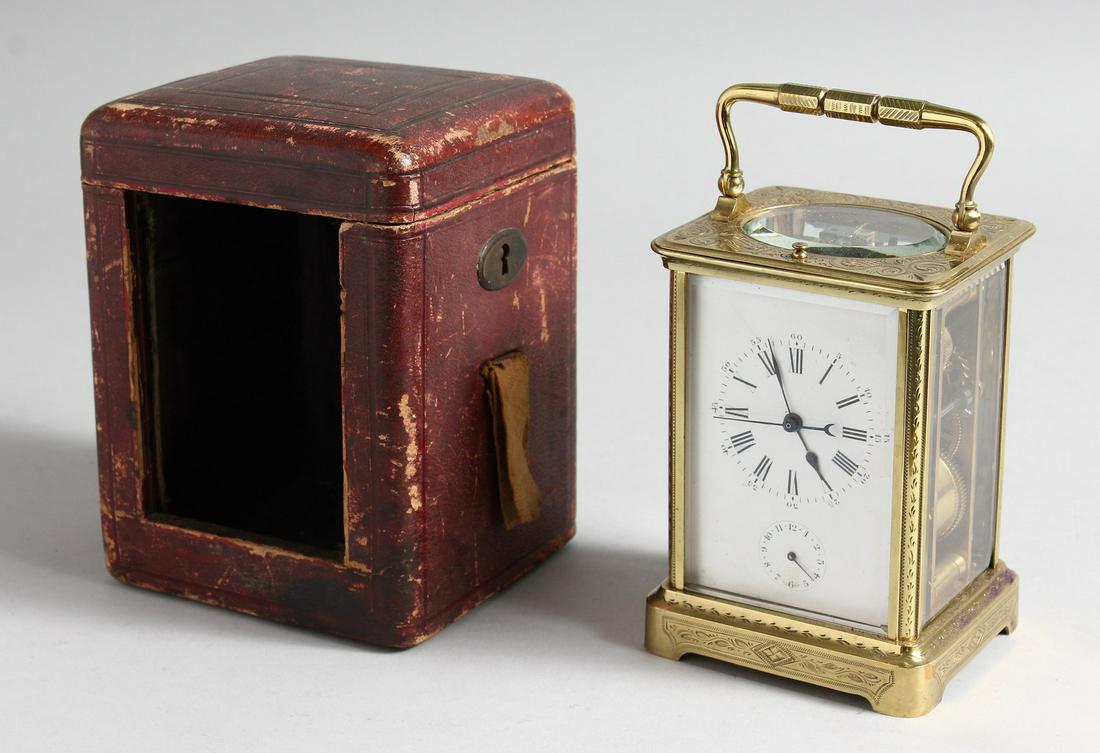 A GOOD FRENCH ENGRAVED BRASS CARRIAGE CLOCK with eight day movement, striking on a gong, enamel dial: A GOOD FRENCH ENGRAVED BRASS CARRIAGE CLOCK with eight day movement, striking on a gong, enamel dial with subsidiary dial and second hand, repeat button, in a leather travelling case. 5.25ins high. ex
