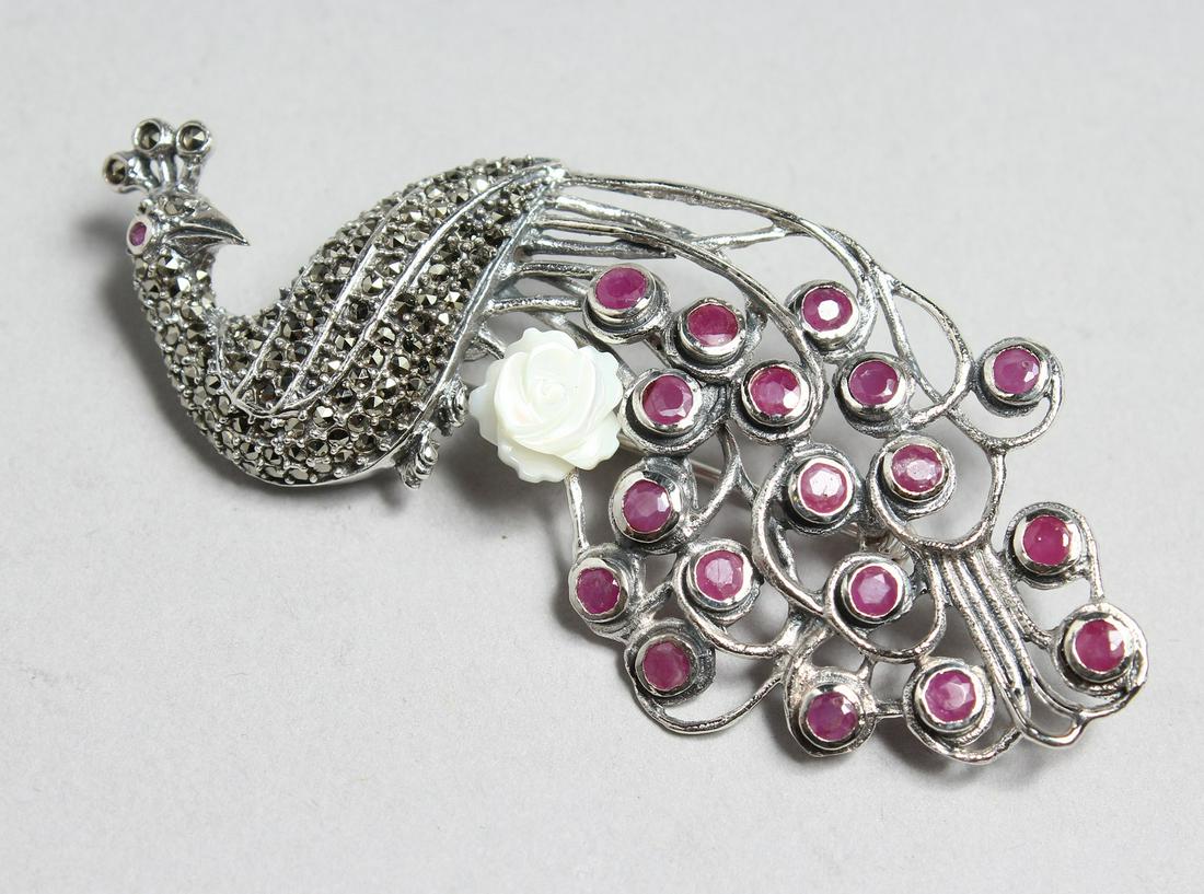 A SILVER, RUBY AND MARCASITE PEACOCK BROOCH.: A SILVER, RUBY AND MARCASITE PEACOCK BROOCH.