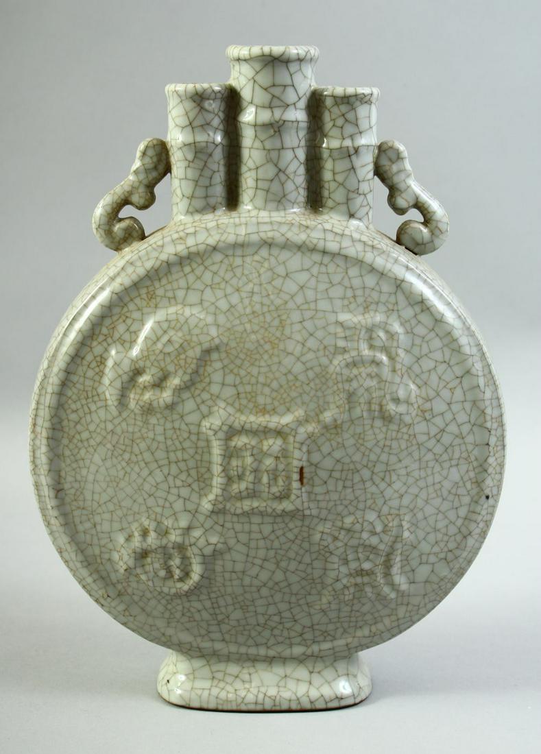 AN EARLY 20TH CENTURY CHINESE CRACKLE GLAZED MOON FLASK / FLOWER VASE, with twin handles and three: AN EARLY 20TH CENTURY CHINESE CRACKLE GLAZED MOON FLASK / FLOWER VASE, with twin handles and three spouts, 31cm high.