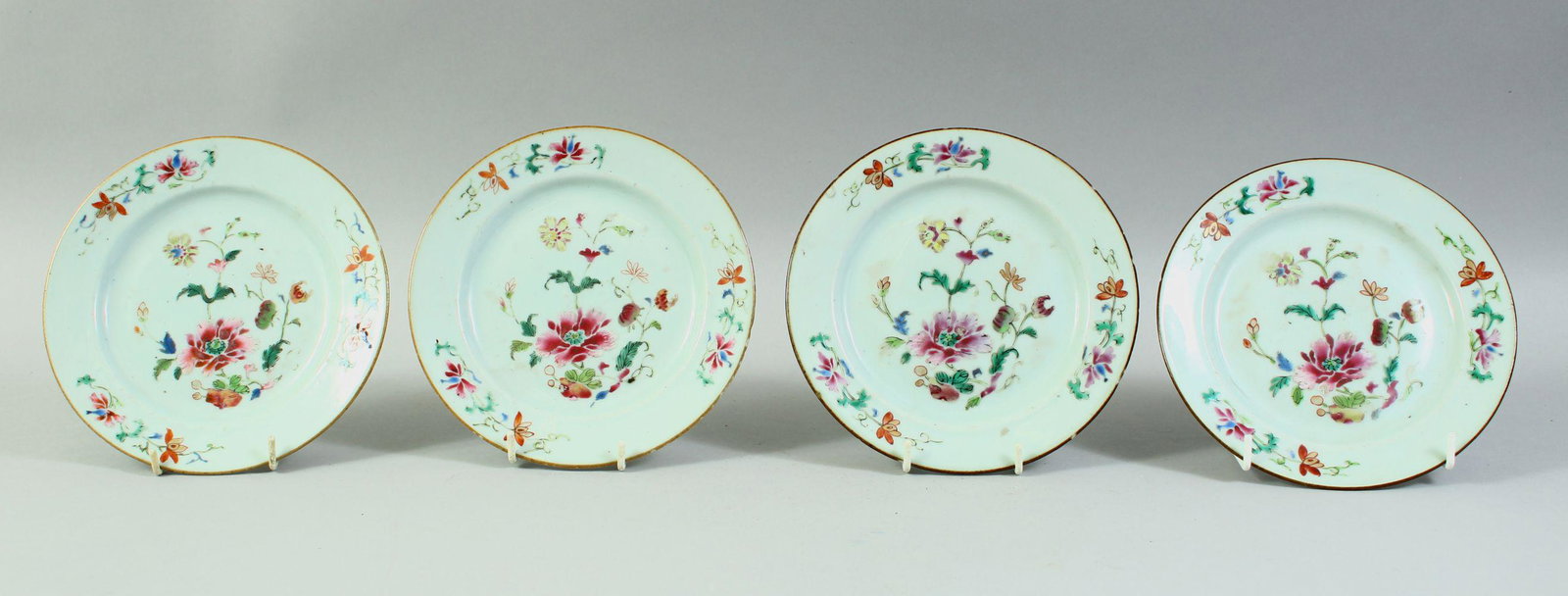 FOUR CHINESE FAMILLE ROSE PORCELAIN DISHES, each painted with flowers, 16.5cm diameter.: FOUR CHINESE FAMILLE ROSE PORCELAIN DISHES, each painted with flowers, 16.5cm diameter.