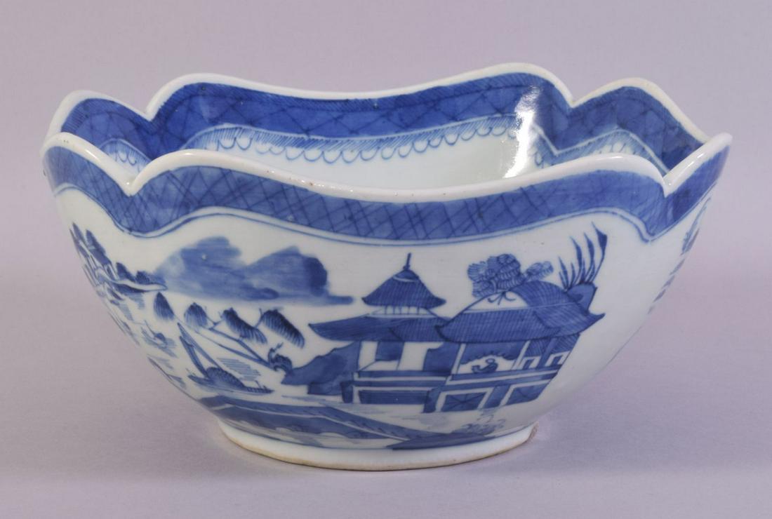 A CHINESE BLUE AND WHITE PORCELAIN BOWL, decorated with a landscape including buildings, boats and: A CHINESE BLUE AND WHITE PORCELAIN BOWL, decorated with a landscape including buildings, boats and trees, 25cm diameter.