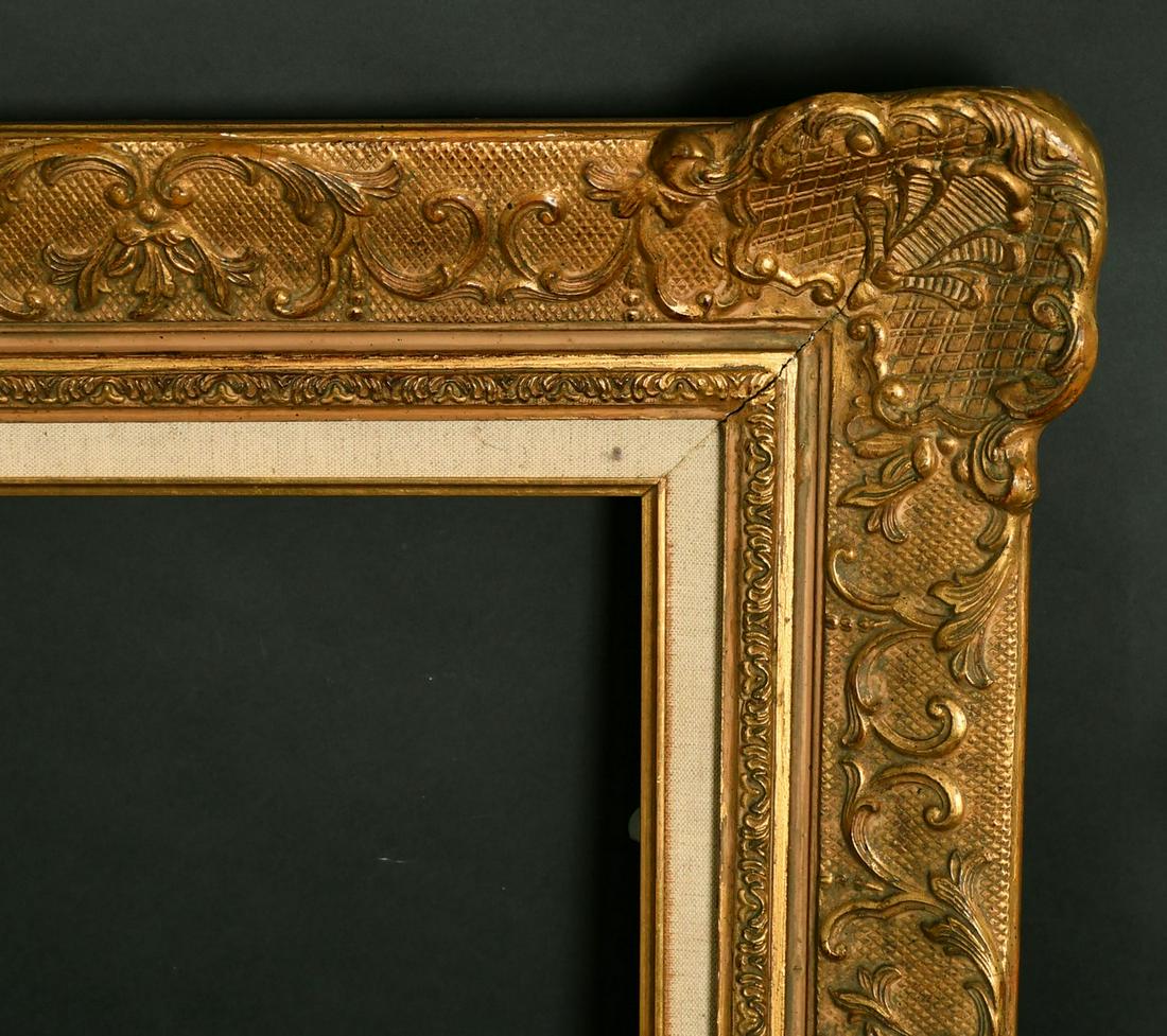 A 20th Century gilt composition frame, rebate size 27.25" x 32.25", (69cm x 82cm). (1 of 2)
