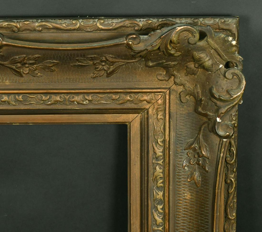 A 19th Century gilt composition frame, rebate size 18" x 26" (46 x 66 cm). (1 of 2)