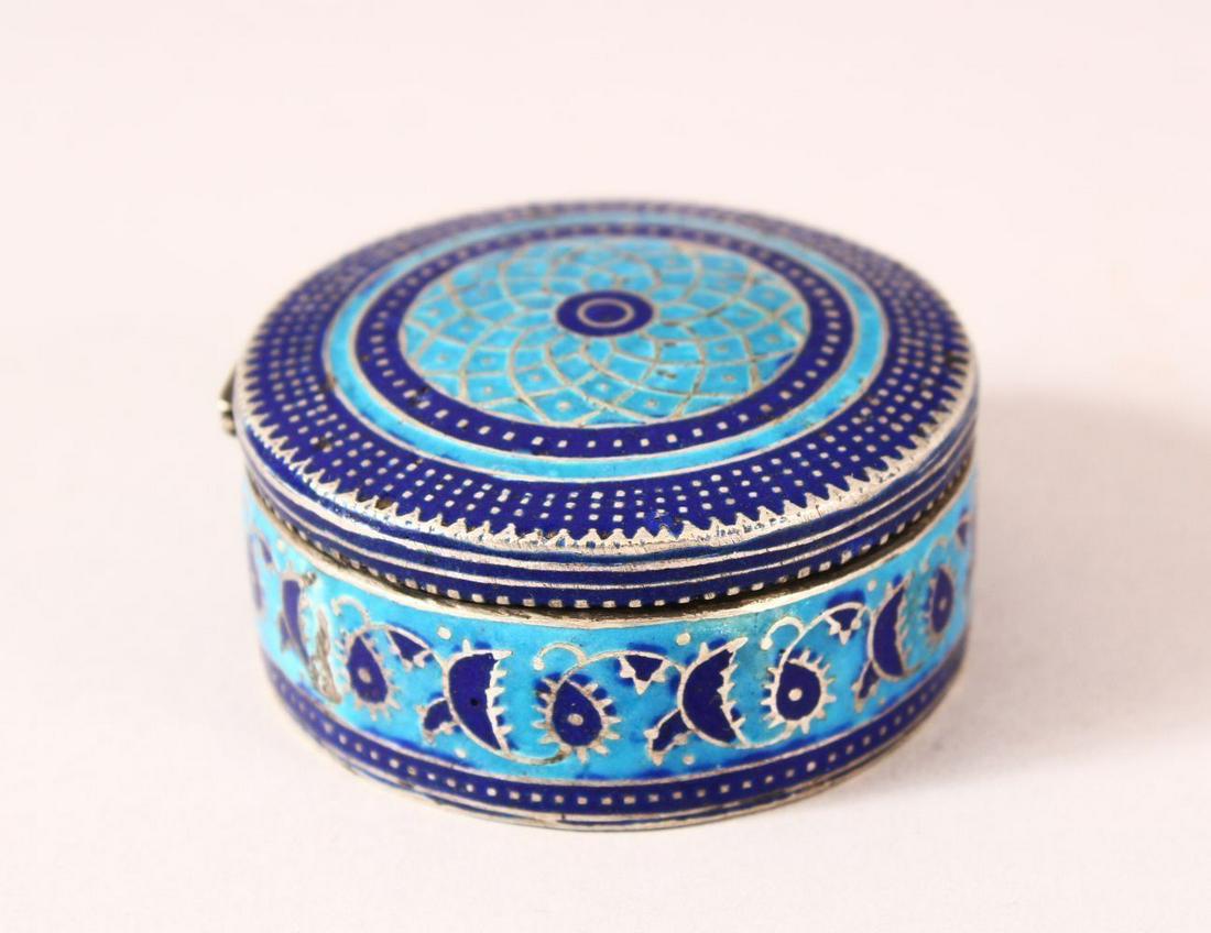 AN INDIAN ENAMELED SILVER LIDDED PILL BOX - the box with geometric banded decoration, with a hinged: AN INDIAN ENAMELED SILVER LIDDED PILL BOX - the box with geometric banded decoration, with a hinged lid, 5.5cm