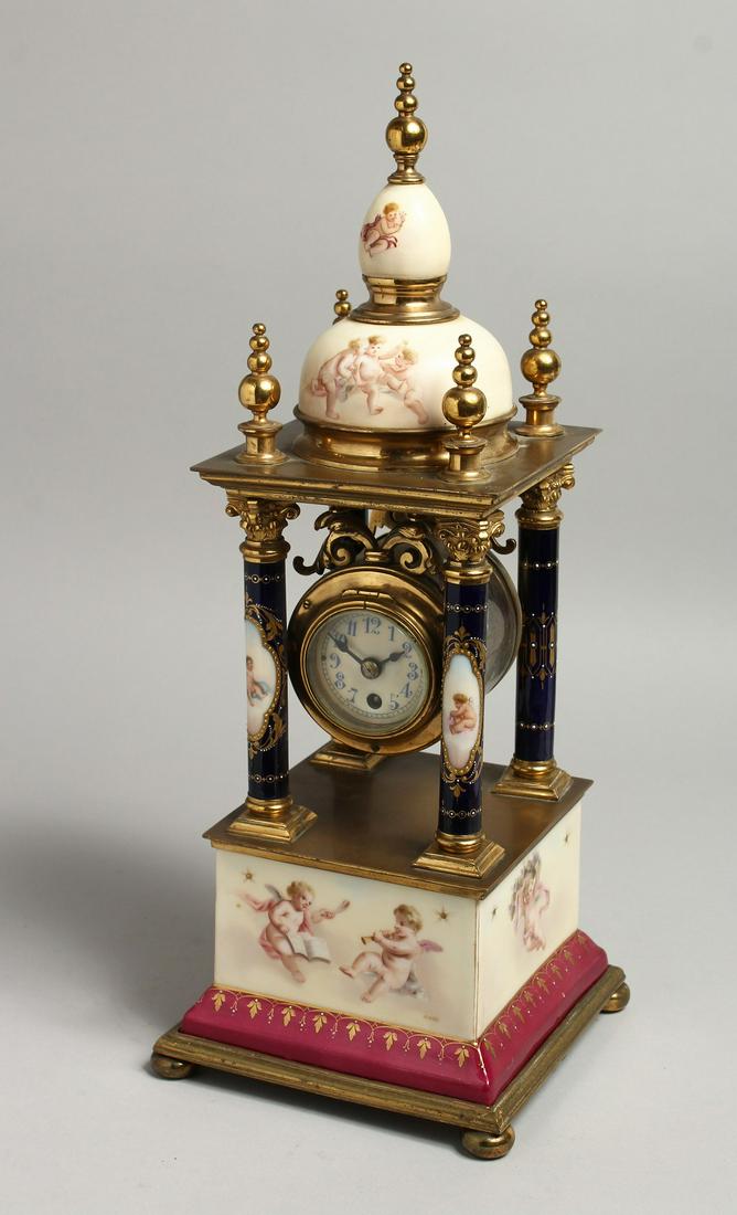 A VERY GOOD 19TH CENTURY VIENNA PORCELAIN CLOCK with four column supports and painted with cupids. (1 of 7)