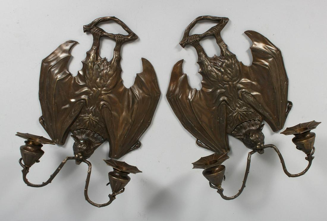 A PAIR OF METAL BAT WING SCONCES.  12ins. (1 of 2)