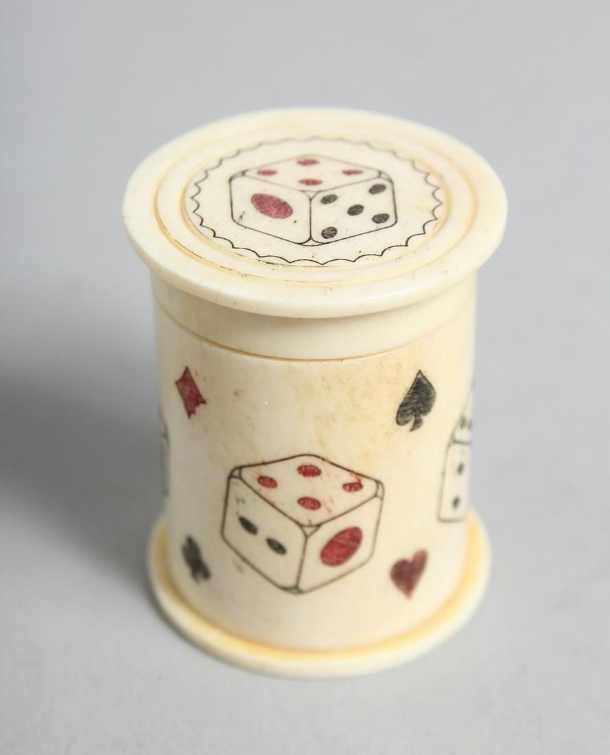 A HAND CARVED BONE DICE SHAKER. 1.75ins: A HAND CARVED BONE DICE SHAKER. 1.75ins