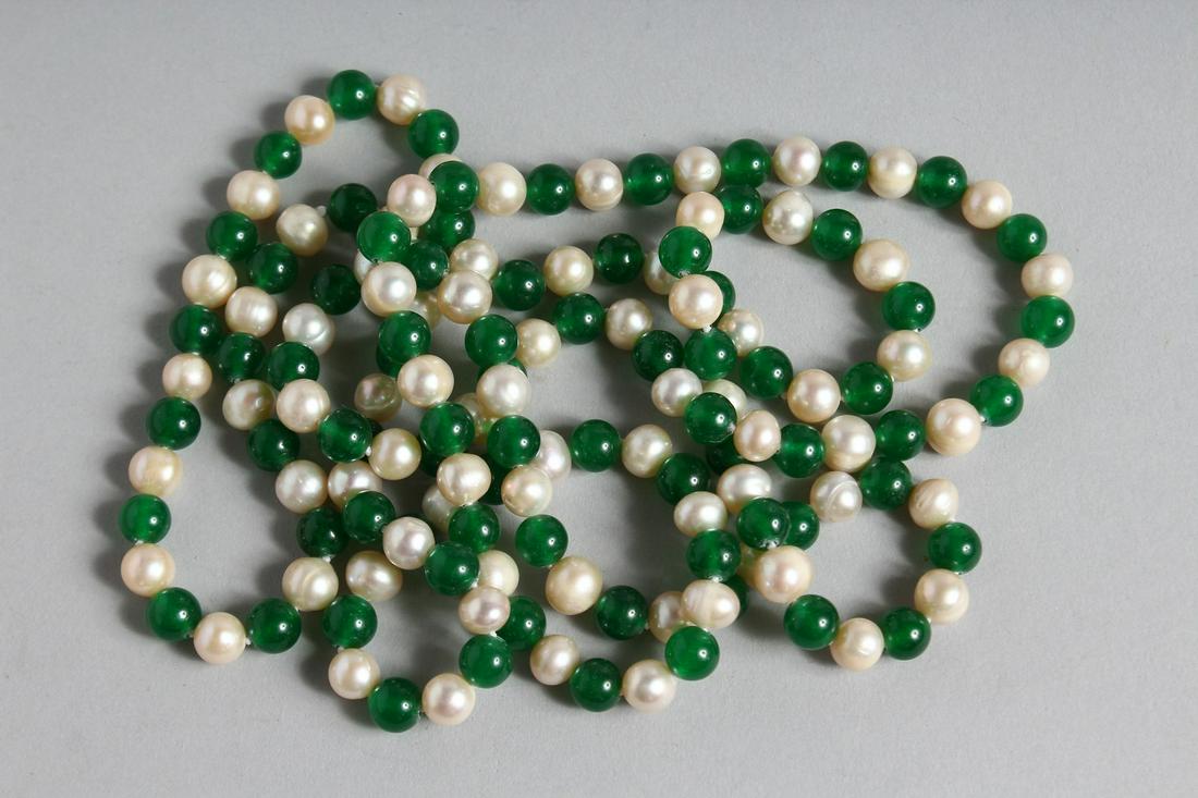 A LONG STRING OF JADE AND PEARL BEADS. 46ins long.: A LONG STRING OF JADE AND PEARL BEADS. 46ins long.