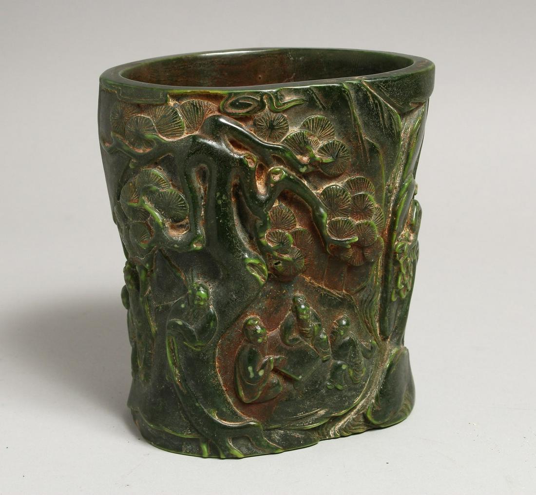 A CHINESE JADE BRUSH POT covered with figures and lotus. 6ins high.: A CHINESE JADE BRUSH POT covered with figures and lotus. 6ins high.