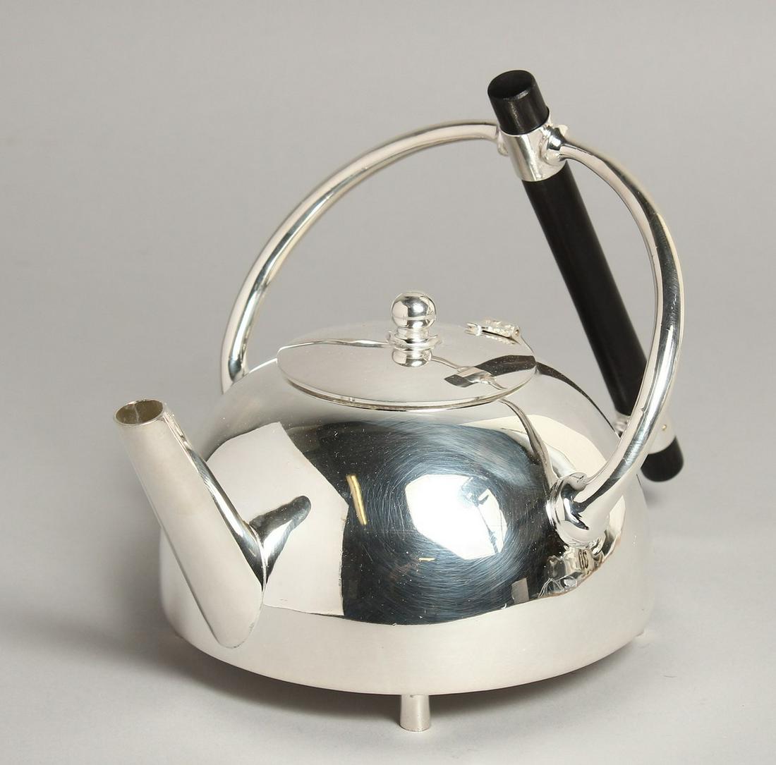 A SMALL CHRISTOPHER DRESSER DESIGN CIRCULAR PLATED TEA POT.: A SMALL CHRISTOPHER DRESSER DESIGN CIRCULAR PLATED TEA POT.