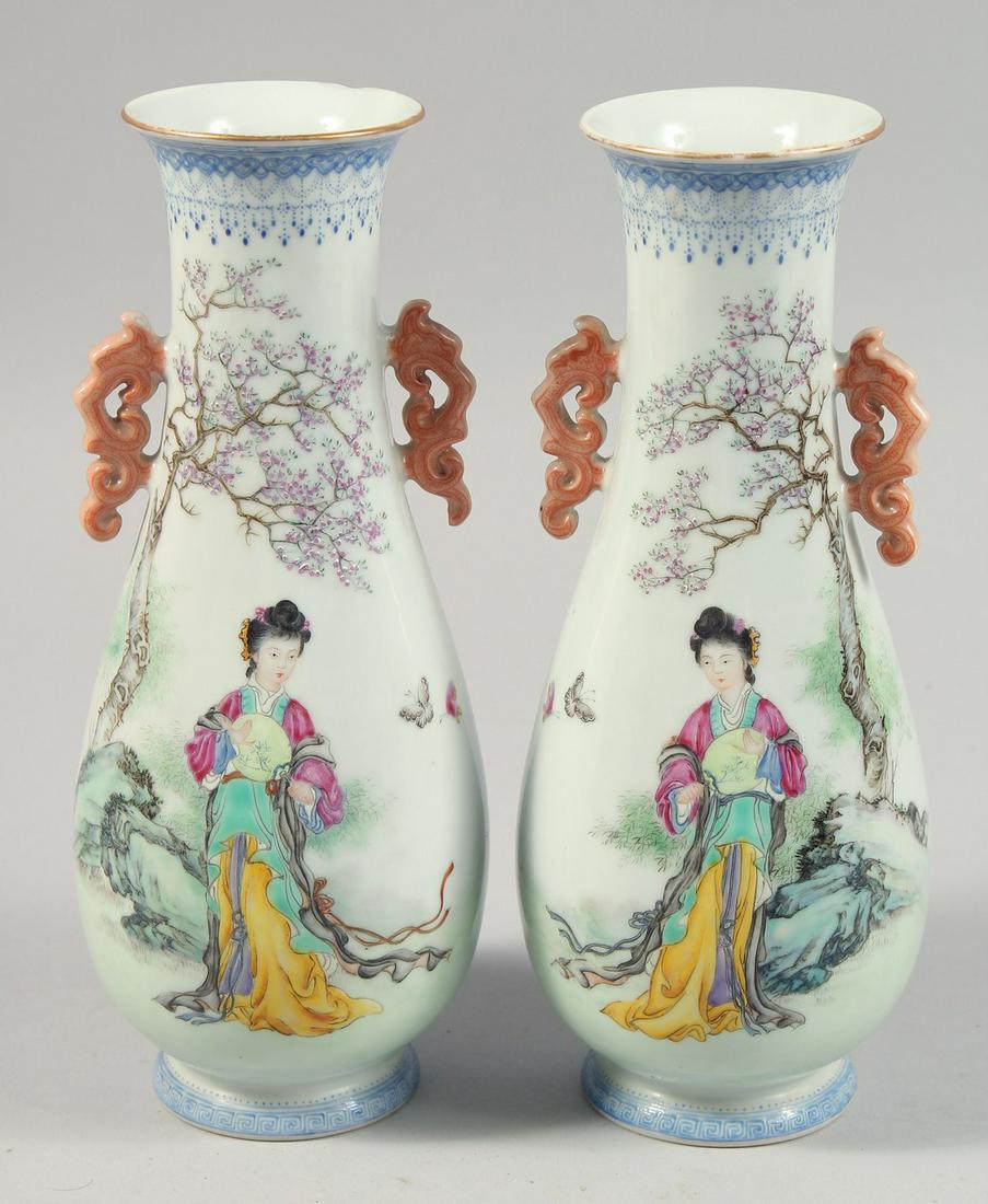 A MIRRORED PAIR OF CHINESE TWIN-HANDLED PORCELAIN VASES, possibly Republic, each painted with female (1 of 6)