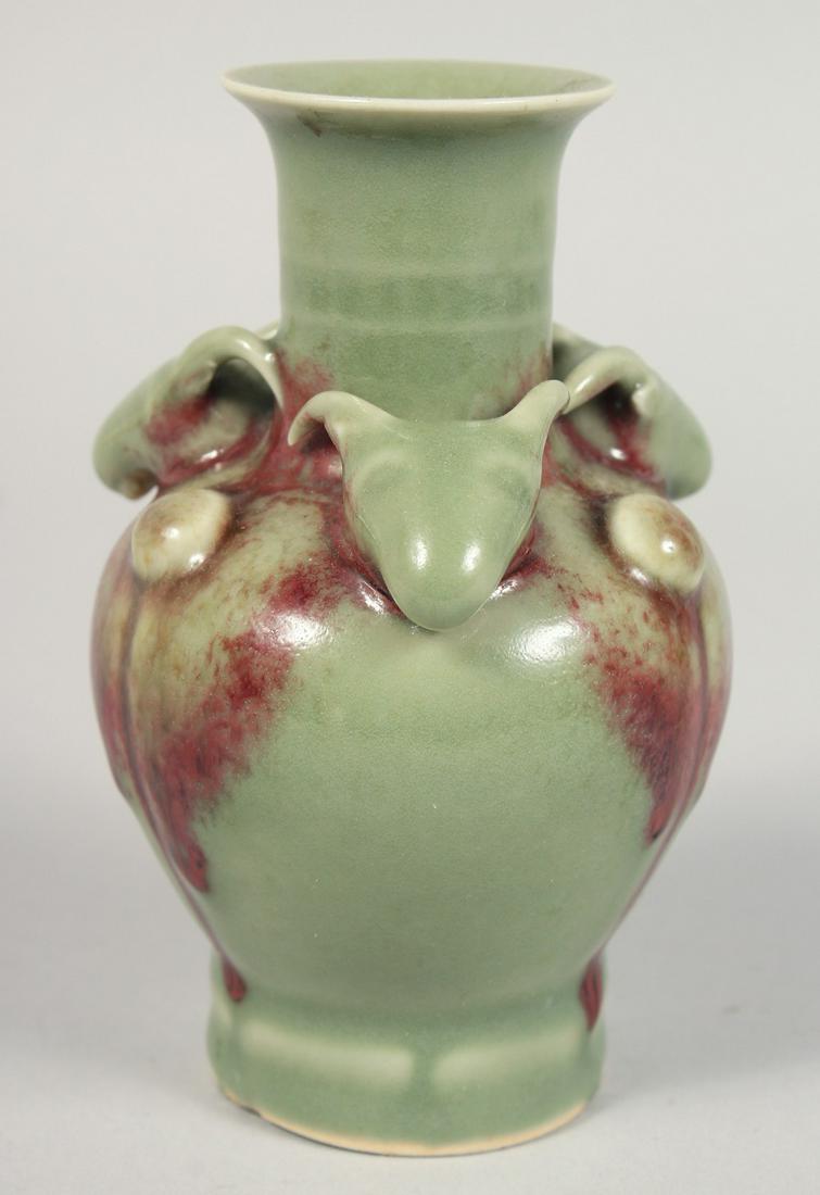 A SMALL CHINESE CELADON GLAZE VASE, with relief moulded ram's heads and three raised bosses to the (1 of 5)