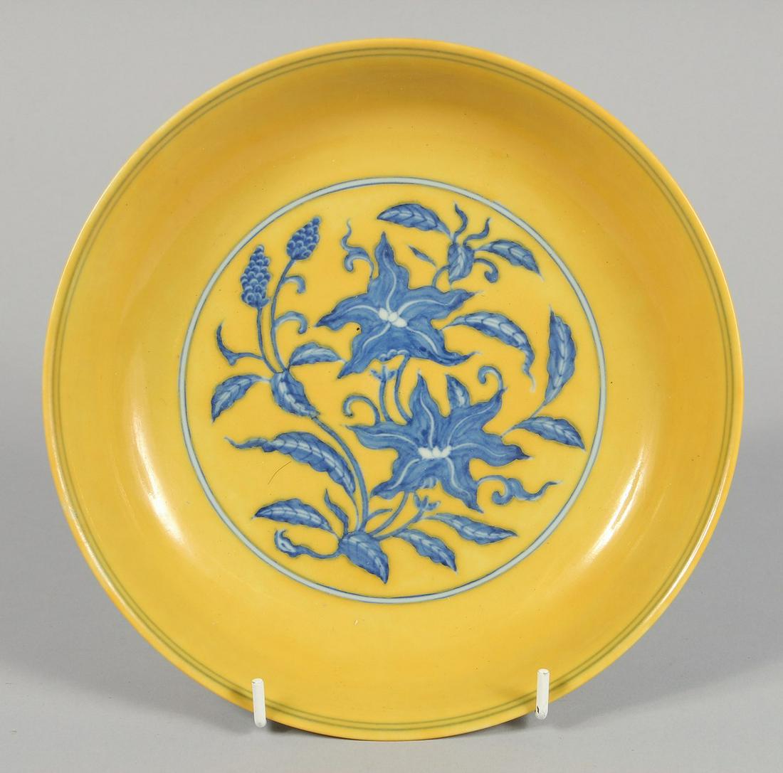 A CHINESE IMPERIAL YELLOW BLUE AND WHITE GROUND PORCELAIN DISH decorated with flora, with (1 of 3)