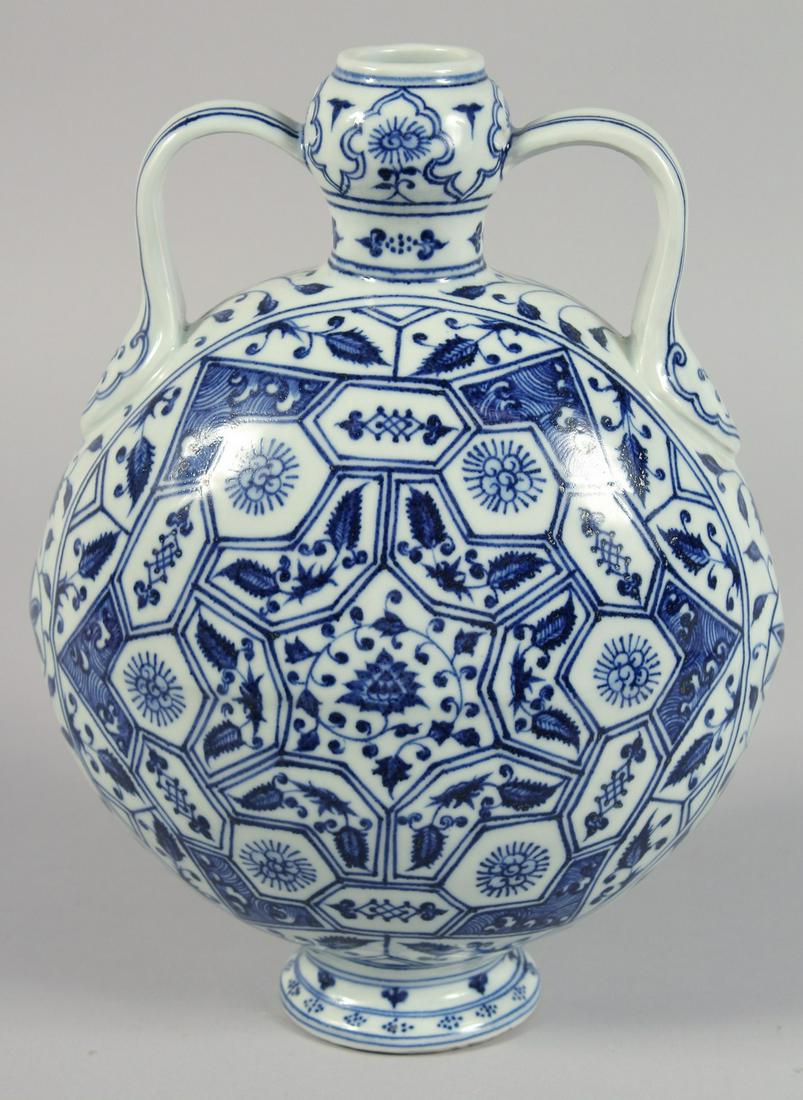 A CHINESE BLUE AND WHITE PORCELAIN TWIN-HANDLED MOON FLASK decorated with multiple panels of flora,: A CHINESE BLUE AND WHITE PORCELAIN TWIN-HANDLED MOON FLASK decorated with multiple panels of flora, the base with four-character mark. 28cm high