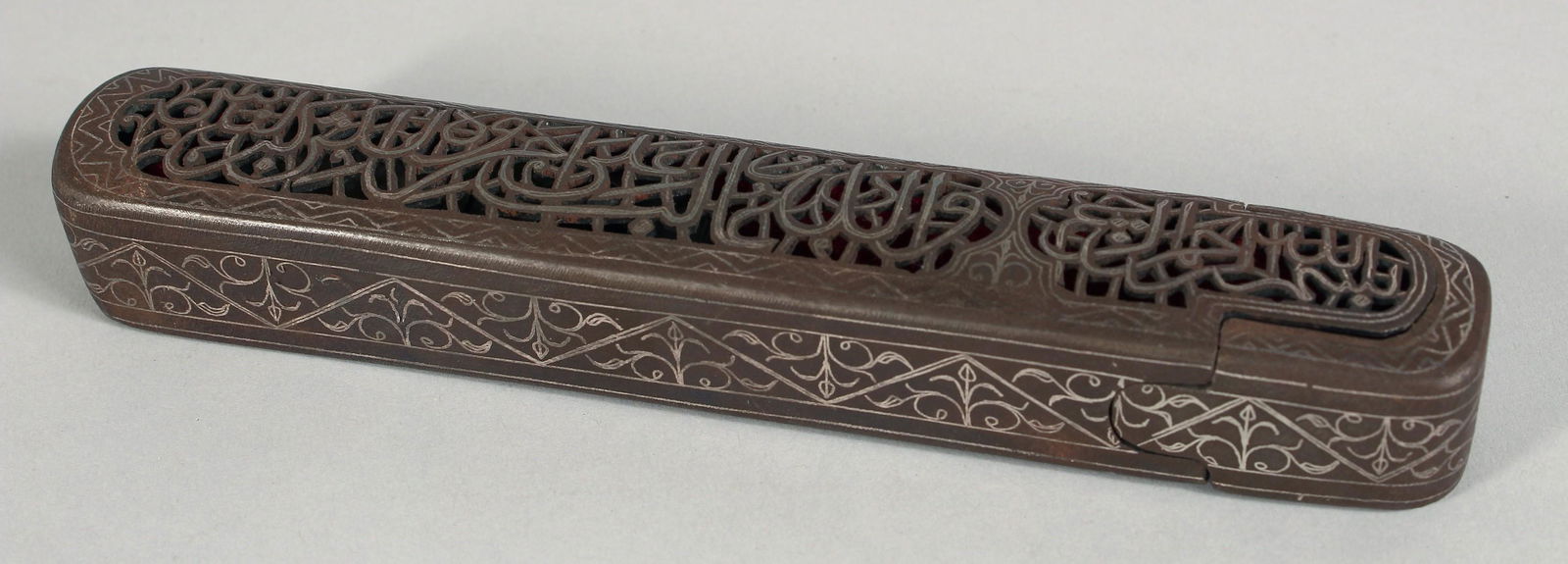 A 19TH CENTURY ISLAMIC OPENWORK PEN BOX, inlaid with silver wire decoration, the top with openwork (1 of 5)