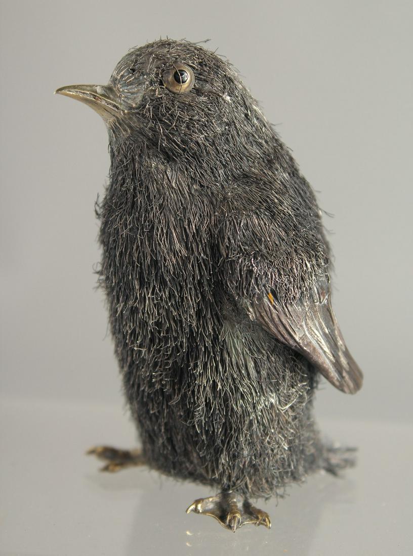 A MARIO BUCCULLATI SILVER THREAD PENGUIN. Signed. 3ins high in a blue box.: A MARIO BUCCULLATI SILVER THREAD PENGUIN. Signed. 3ins high in a blue box.