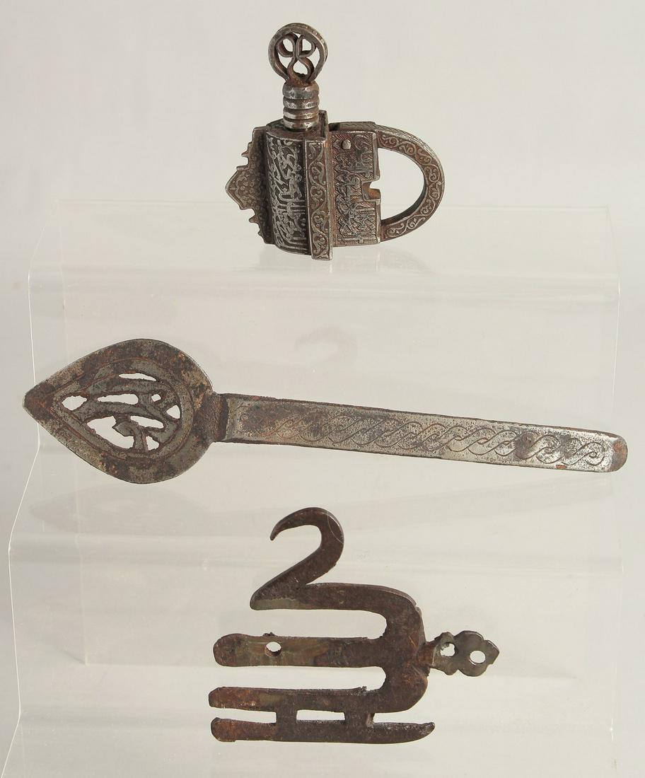 AN ISLAMIC STEEL PADLOCK, together with two other steel items; alam finial and helmet noseguard,: AN ISLAMIC STEEL PADLOCK, together with two other steel items; alam finial and helmet noseguard, (3).