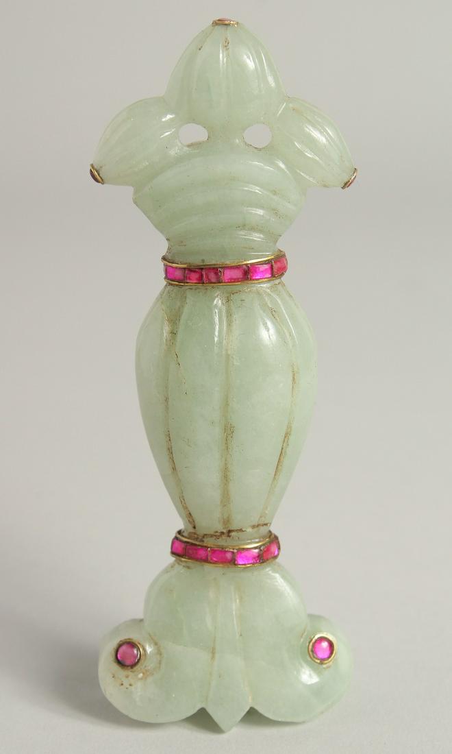 A MUGHAL STYLE CARVED JADE DAGGER HANDLE, onlaid with semi-precious stones, 13.5cm long.: A MUGHAL STYLE CARVED JADE DAGGER HANDLE, onlaid with semi-precious stones, 13.5cm long.