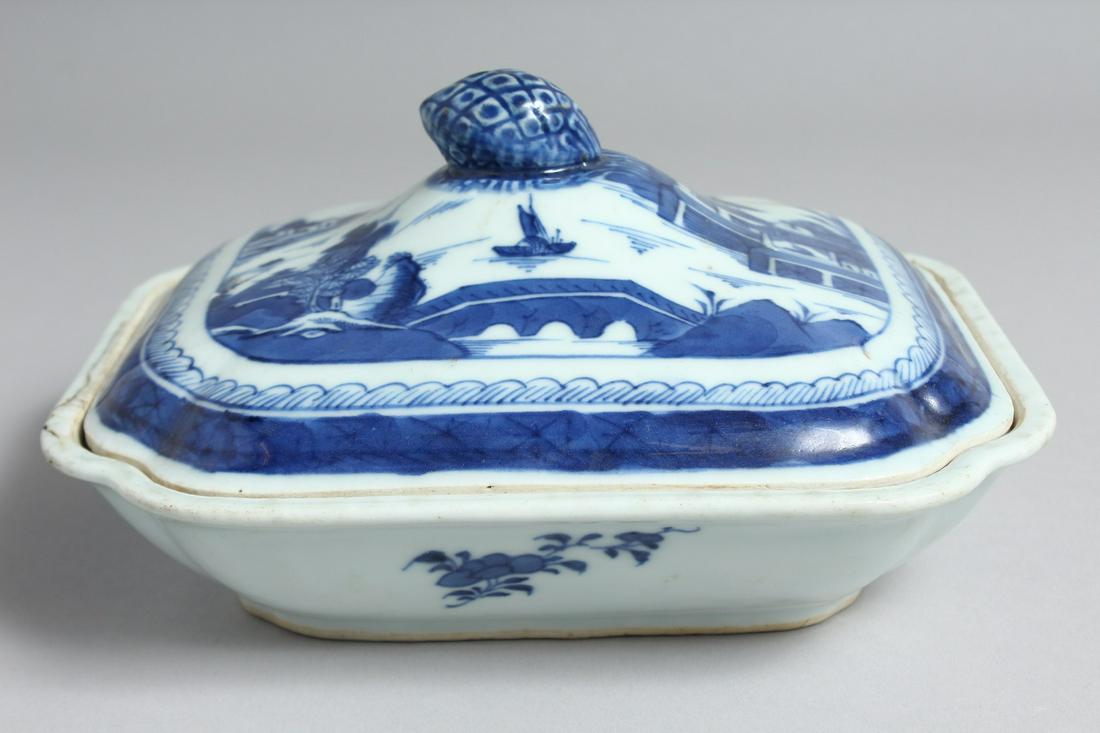 A CHINESE BLUE AND WHITE PORCELAIN TUREEN AND COVER, the cover and interior decorated with landscape: A CHINESE BLUE AND WHITE PORCELAIN TUREEN AND COVER, the cover and interior decorated with landscape scenes. 21cm long x 18cm wide