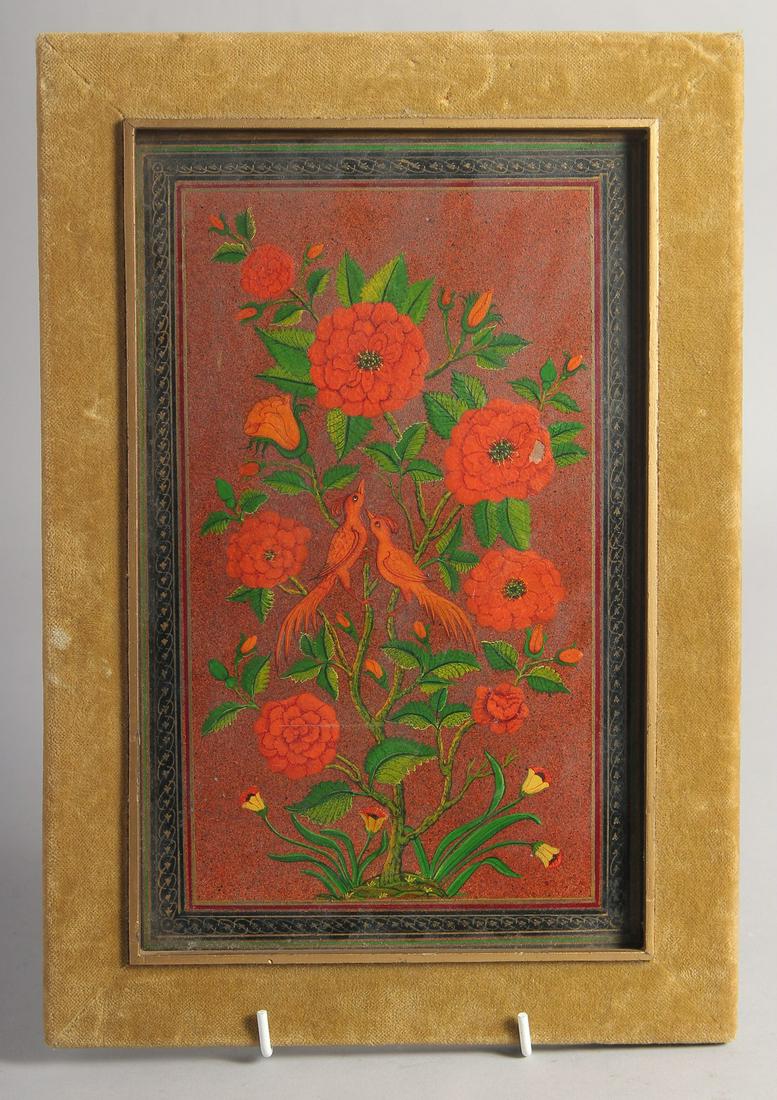 A PERSIAN QAJAR PAINTED AND LACQUERED FLORAL PANEL encased in a velvet and wood frame, double-sided,: A PERSIAN QAJAR PAINTED AND LACQUERED FLORAL PANEL encased in a velvet and wood frame, double-sided, painted with birds and native flora, the panel measuring 27cm x 16.5cm