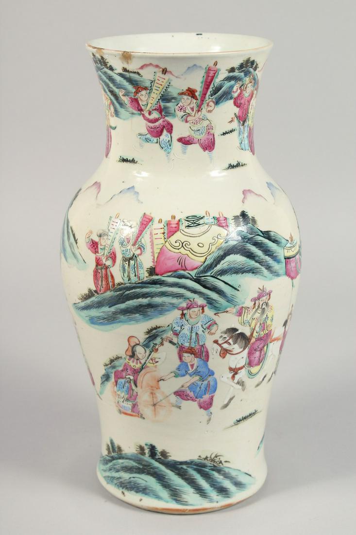 A LARGE CHINESE FAMILLE ROSE PORCELAIN VASE painted with warriors on horseback, and other figures in: A LARGE CHINESE FAMILLE ROSE PORCELAIN VASE painted with warriors on horseback, and other figures in a landscape setting. 34.5cm high