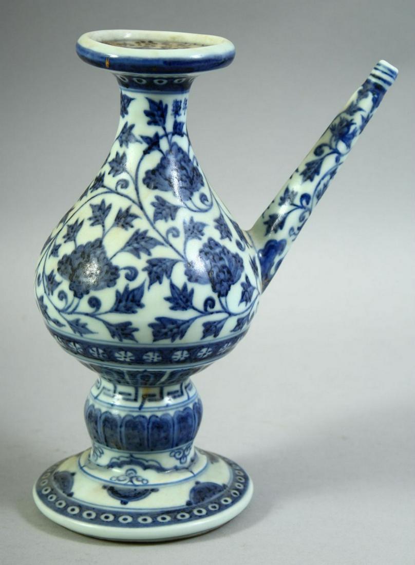 A CHINESE BLUE AND WHITE MING STYLE PORCELAIN WATER DROPPER, painted with floral decoration, the: A CHINESE BLUE AND WHITE MING STYLE PORCELAIN WATER DROPPER, painted with floral decoration, the neck bearing six-character mark, 21.5cm high.
